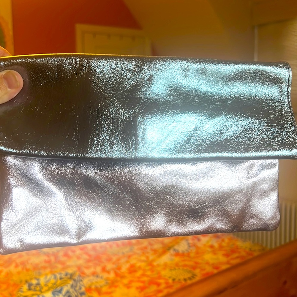Clutch purse. Pink and blue with gold interior snap. Like new. Shiny like foil.